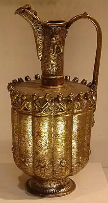 Seljuk-era art: Ghurid Ewer from Herat, Afghanistan, dated 1180–1210 AD. Brass worked in repousse and inlaid with silver and bitumen. British Museum.