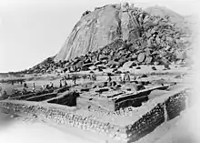 A black and white photograph of an archaeological excavation site