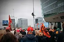 Member of the Extinction Rebellion Climbing Division high up on a pole to make arrest by the police more difficult