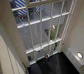 Very high windows in the entrance to a residential building in Ystad.