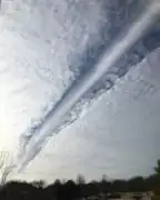 Elongated fallstreak hole over Bixby