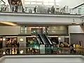 Escalators inside the Festival Walk mall connecting to CityU