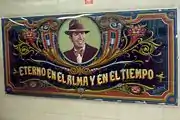 Fileteado-style portrait of Carlos Gardel located opposite the ticket counter