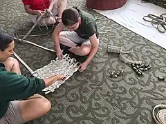 Keepers at a workshop learning how to repurpose old firehouses into animal enrichment items.