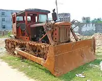 A  First Tractor Company bulldozer still operational in 2012 on Xinbu Island, Hainan, China