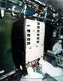 A rack being fitted in the Destiny laboratory