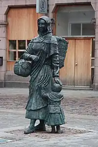 Statue of a fishwife carrying a creel and basket