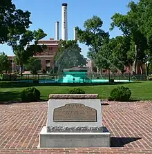 Circular fountain in park with water jets coming from sides