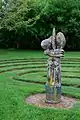 Sentinel of the Labyrinth at Wychwood encrusted with lichen"