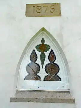 Window with 1875 datestone