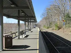 A railway platform next to a single track