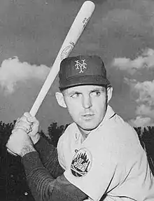 A photograph from a 1963 baseball card showing Thomas holding a bat