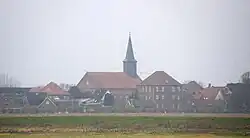 Panorama of the town in the early morning fog