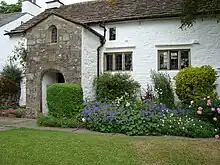 The Friends Meeting House and adjoining cottage to west