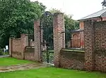 Walls, gate piers and gates to south of stable block at former Foots Cray Place