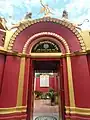 Front view of the entrance gate of Rani Rashmoni Kachari Bari. In 1852, when the Nadia royal family could not retain the zamindari of Nabadwip, Rani Rasmoni bought the zamindari of Nabadwip. She then built this kachari house in Nabadwip to manage the zamindari of Nabadwip. There are temples of Radha Govinda Jiu and Gouranga Jiu served by Rani Rasmoni.