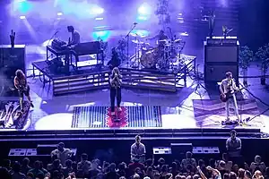 A band performs for a live audience.