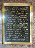 Plaque commemorating the Easter Rising at the General Post Office, Dublin, with the Irish text in Gaelic script, and the English text in regular Latin script