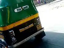 A dialogue and image of Gabbar Singh painted on the back of an auto rickshaw