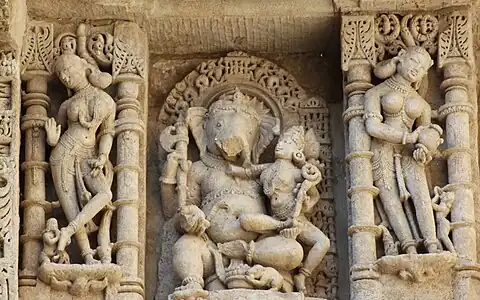 Ganesha with his consort and Apsaras