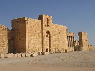 Stone wall, with an arch and pillars