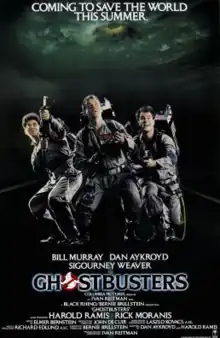 The poster for Ghostbusters (1984), featuring actors Harold Ramis, Bill Murray, and Dan Aykroyd in characters looking above.