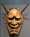 Japanese wooden mask depicting demon.