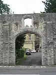 Wall around grounds of Glastonbury Abbey and Abbey Retreat House, including the gate way on Chilkwell Street