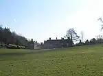 Gledstone Hall and forecourt walls, pavilions and gates