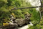 Suspension Footbridge Over River Garry By Hydro Dam