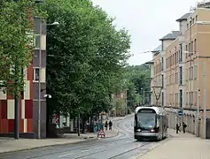 The stop, with sign and surface treatment to deter road traffic