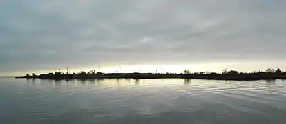 Gråen in January 2018, seen from a quay at Landskrona harbour. The wind turbines are located around "the Plaster Island", the small tower to the right is from the 18th century and is called "Kruttornet" ("the Gun Powder tower")