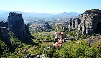 Rock formations and a monastery building