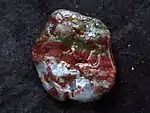 Green-and-red jasper pebble with areas of grey, translucent chalcedony, Aomori Prefecture, Shichiri Nagahama, Japan