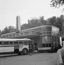 A Greyhound bus stops at the Half-Way House, September 1943