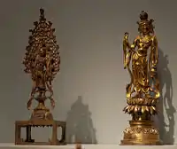 Two Guanyin statues in gilt-bronze; only small bronze statues like this have survived.