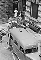 A patient being placed in an ambulance at Guy's Hospital, London. An AAGB member can be seen on the left, 1941.