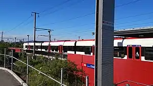 White-and-red train at platform