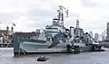 HMS Belfast repainted in Admiralty camouflage