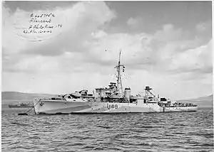 Photograph of HMS Pheasant moored at a buoy in May 1943