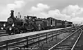 NS 1445 with a train along the platform of Elst. (1935 - 1940)