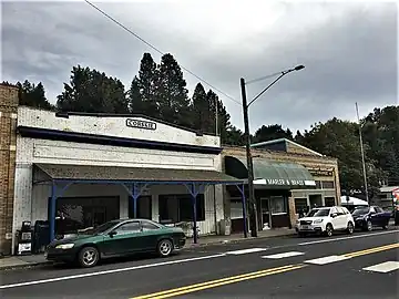 Corskie Building at left, Marier and Brass/Paulsen building at right. Edge of Bridgeman Building at very left.