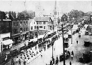 A parade on Washington Street, Norwood, c. 1920.  Looking north towards Norwood Common (on right in distance)