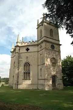 The tower and part of the body of a stone church