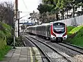 A westbound train consisting of E32000 EMUs used for Marmaray service