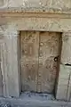 Stone door at entrance to Catacomb no. 20 imitating embossed wooden door