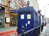 A blue police box on a street