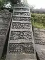 Seven panel Hero Stone from 1152 CE Old with Old Kannada inscription from Shimoga taluk, Karnataka