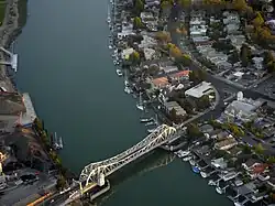 Aerial view of a bascule bridge (drawbridge) spanning the estuary separating Oakland from Alameda.