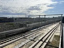 Railway tracks lowering down in concrete dive structure